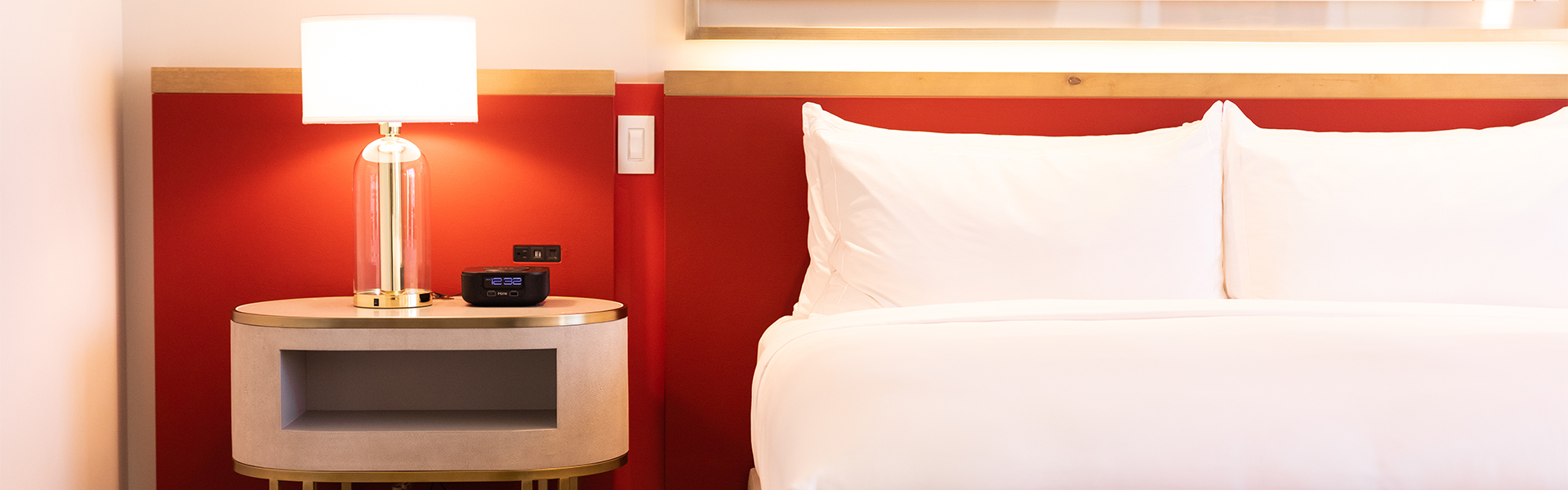 Bedroom red wall and white bed