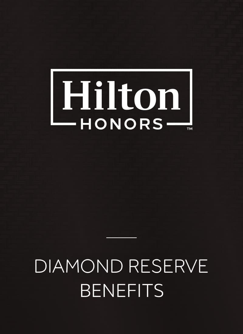 Hilton Honors logo with text reading “Diamond Reserve Benefits” on a dark background