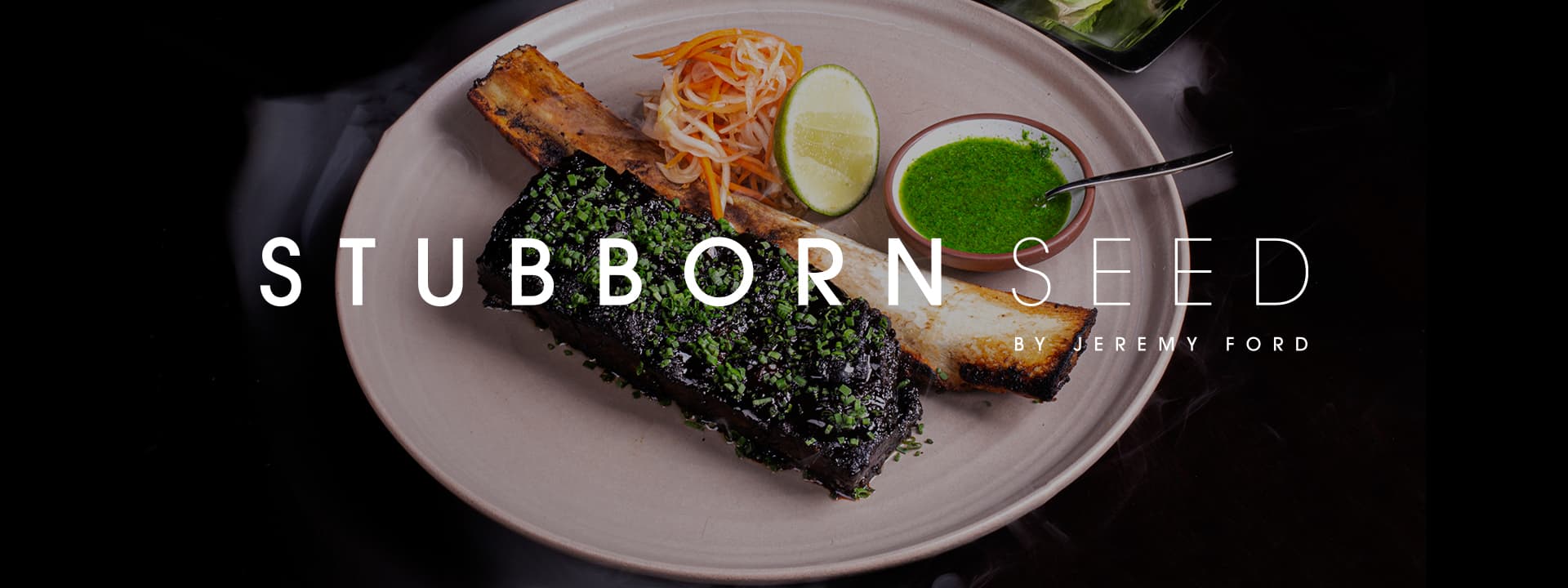 Banner featuring Stubborn Seed by Jeremy Ford with a plated roasted bone marrow dish served with herb sauce, pickled vegetables, lime, and leafy greens on a dark background.