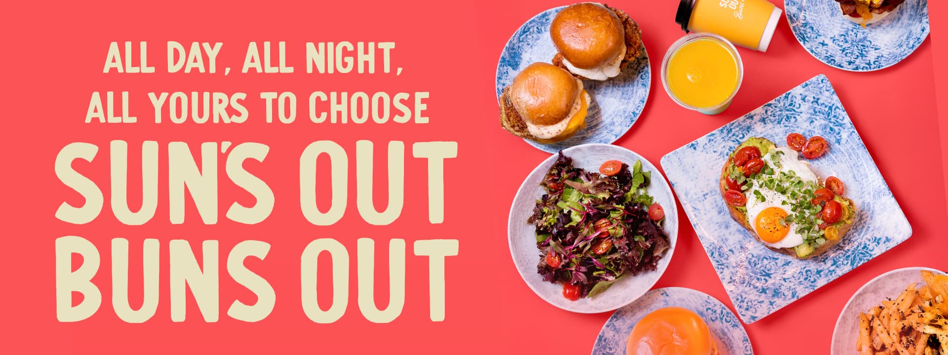 Overhead view of breakfast and lunch dishes including breakfast sandwiches, avocado toast with egg, mixed greens, fries, orange juice, and coffee alongside the message "All Day, All Night, All Yours to Choose. Sun